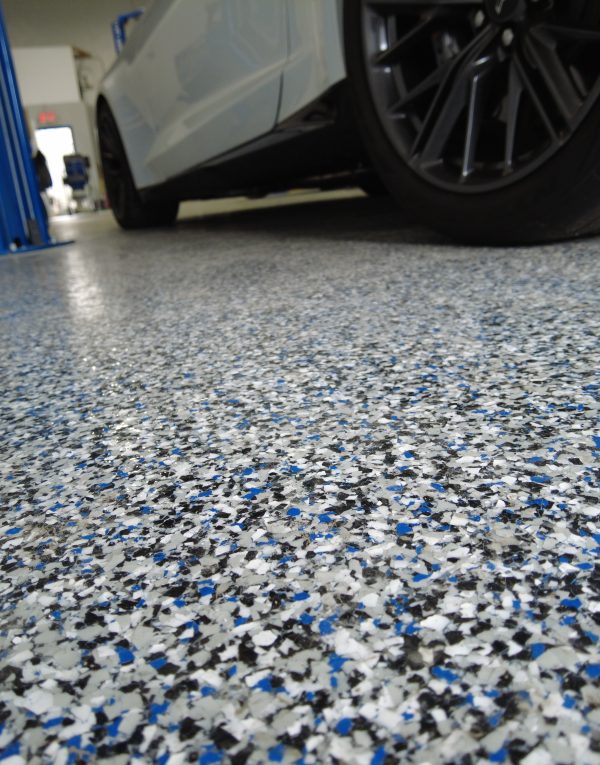 Custom car shop decorative floor with matching car lift